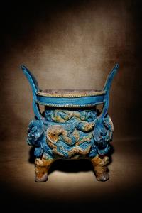 A Turquoise and Ochre Glazed Tileworks Tripod Incense Burner