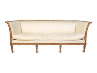A Gustavian Style Carved Natural Wood Upholstered Sofa — 20TH CENTURY
