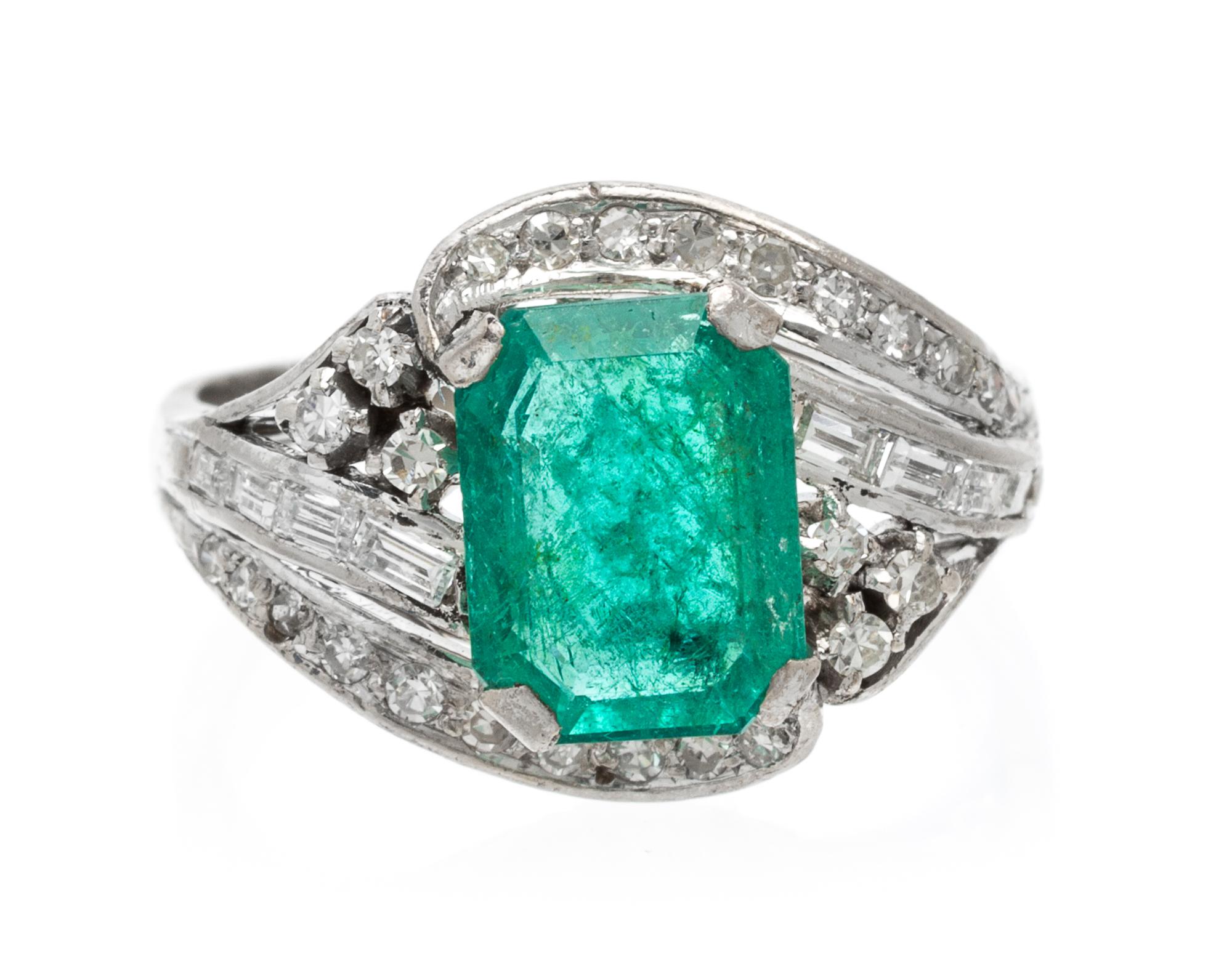 An 18 Karat White Gold, Emerald and Diamond Ring, 2.50 dwts.