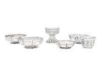 A Group of Six English Arts and Crafts Silver Table Articles