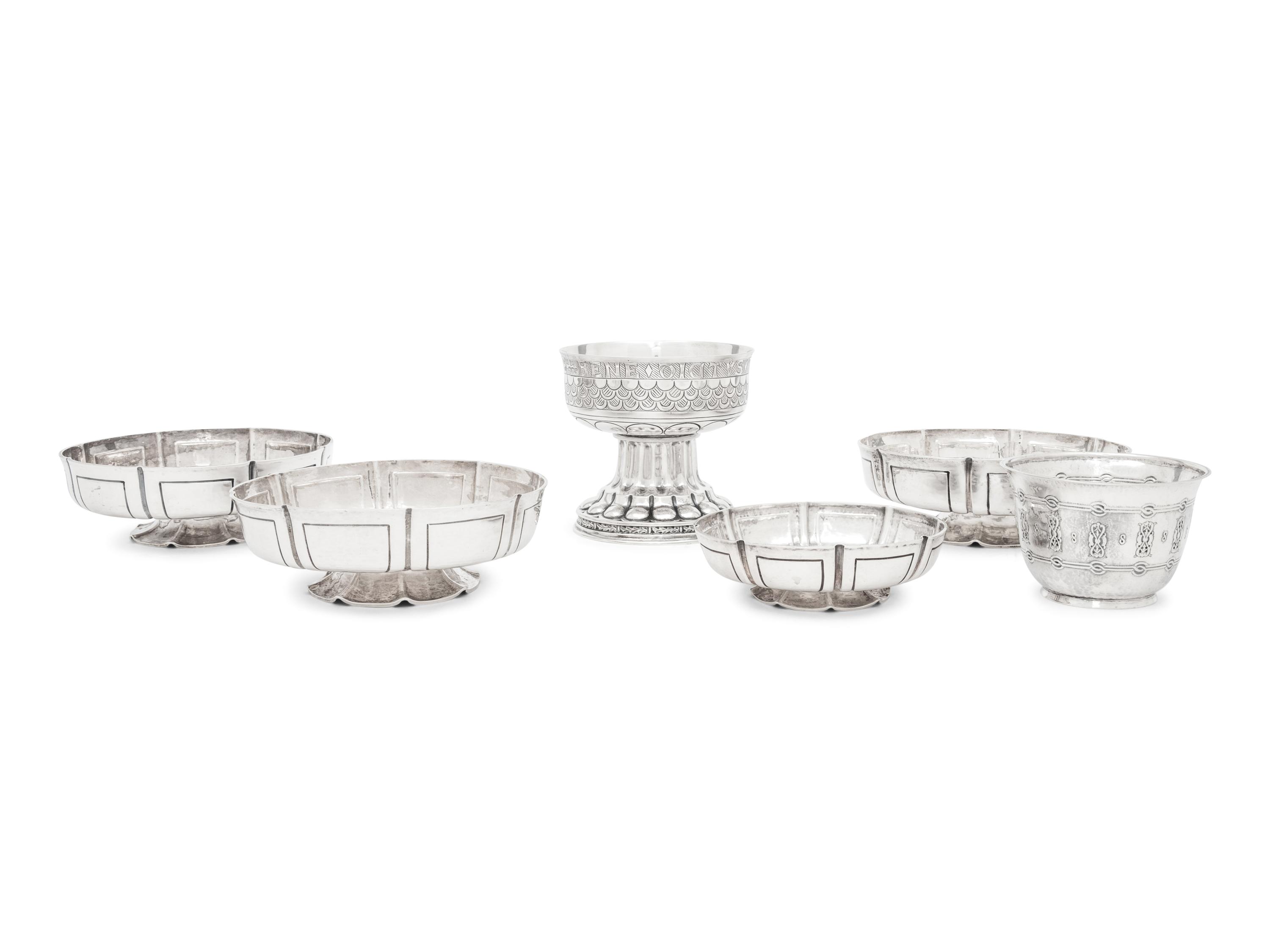 A Group of Six English Arts and Crafts Silver Table Articles