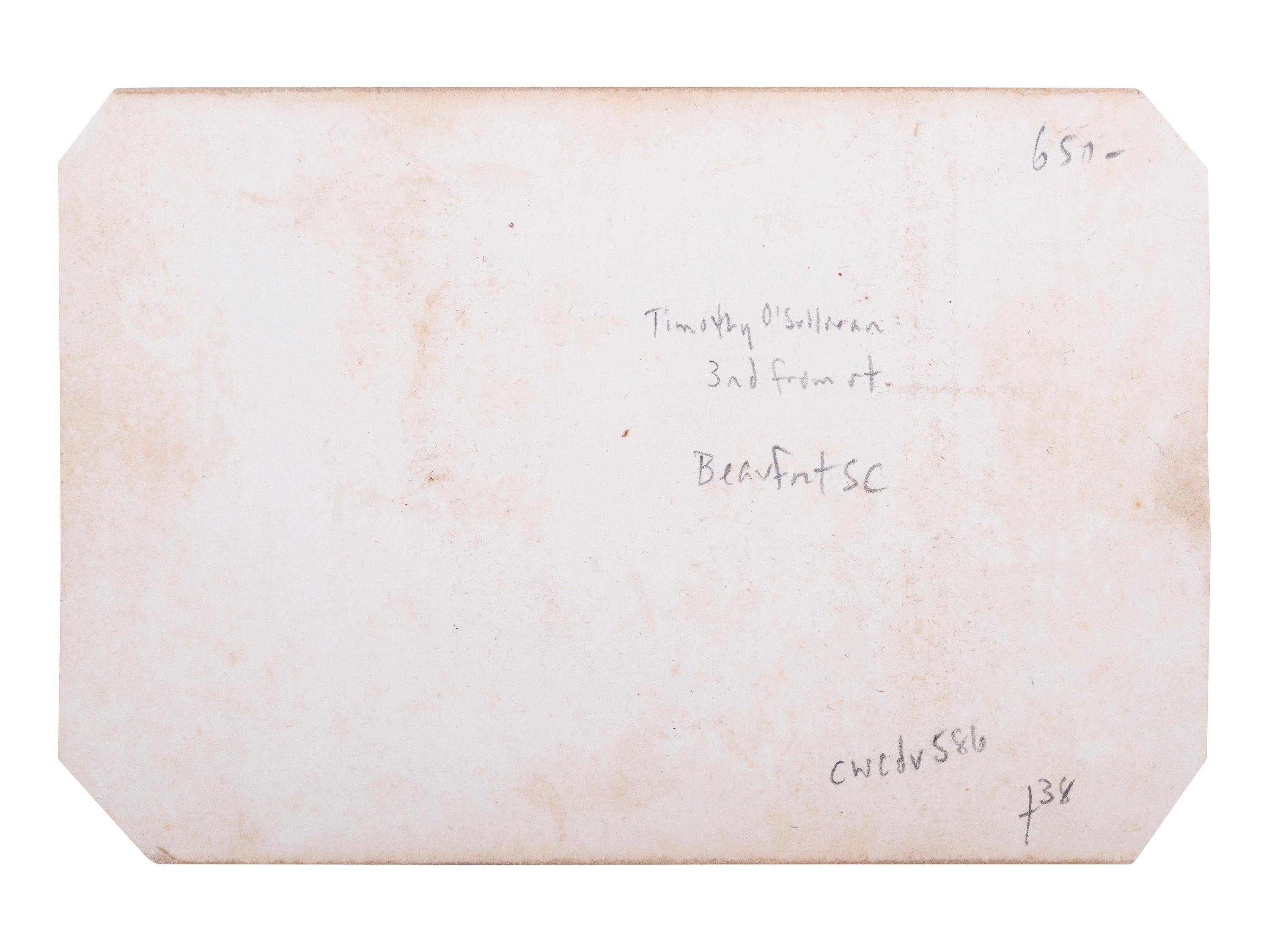 [CIVIL WAR]. O'SULLIVAN, Timothy, photographer. CDV of group of men at Beaufort, SC, possibly including Timothy O'Sullivan, and African American subjects. Washington, DC: M.B. Brady, 1862.