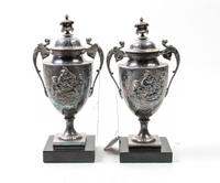 A Pair of Neoclassical Silver-Plate Urns Height of urns 9 3/4 inches. — 19TH/20TH CENTURY