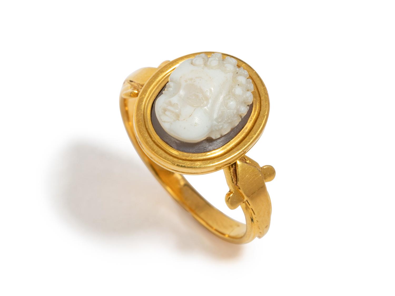 A Roman Onyx Cameo Ring Stone with the Head of a Child — Set in a gold ring