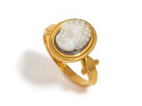 A Roman Onyx Cameo Ring Stone with the Head of a Child — Set in a gold ring