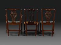 A Set of Six Chippendale Style Carved Mahogany Dining Chairs