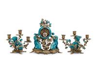 A Louis XV Style Gilt Bronze and Porcelain Clock Garniture