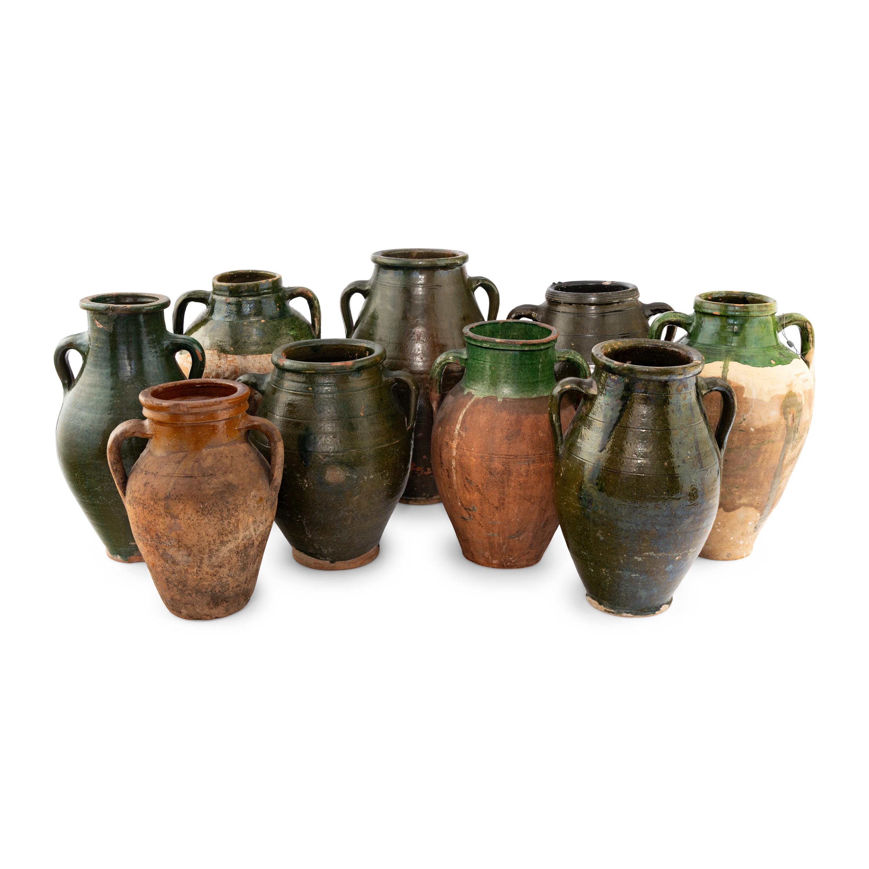A Group of Nine Glazed Earthenware Confit Jars