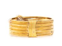 YELLOW GOLD, DIAMOND, AND EMERALD SNAKE BANGLE BRACELET