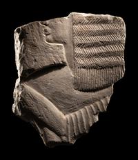An Egyptian Limestone Relief Fragment