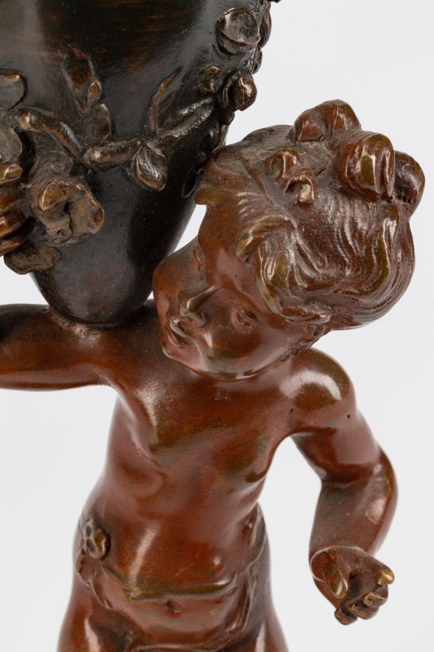 A Pair of French Patinated Bronze Figures of Infant Water Carriers — CIRCA 1900