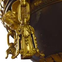 A Pair of Bronze Chandeliers with Cherub Masks 24" W x 24" D x 58" H — United States, Circa 1900