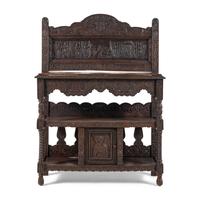 An Elizabethan Style Carved Oak Three-Tier Server