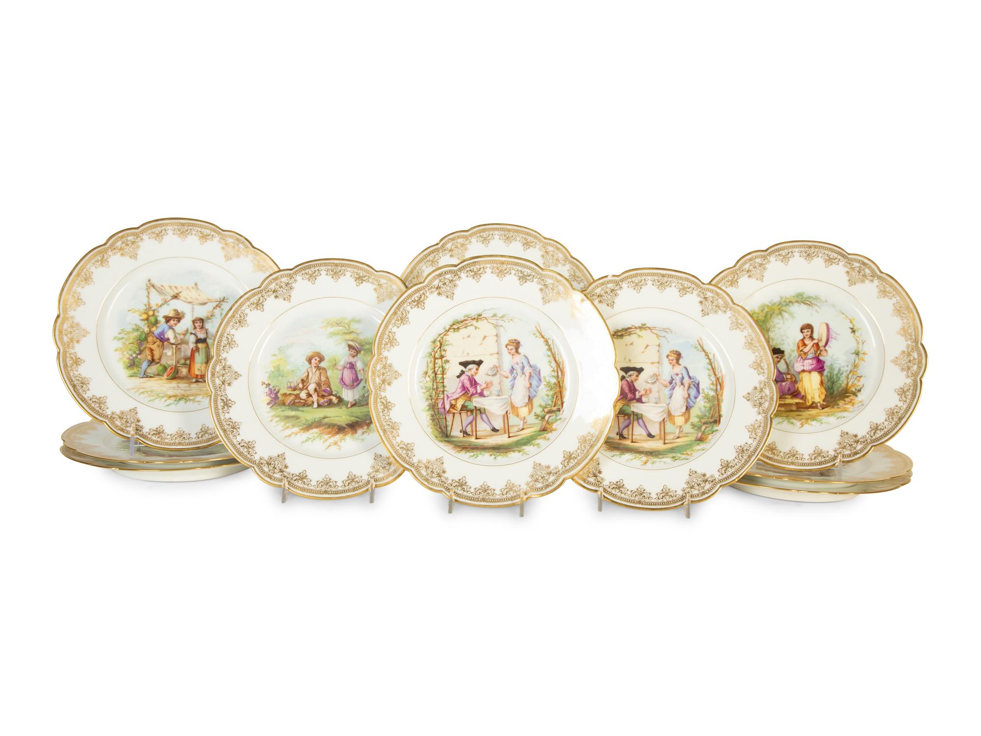 Twelve Sèvres Gilt Decorated Porcelain Dinner Plates