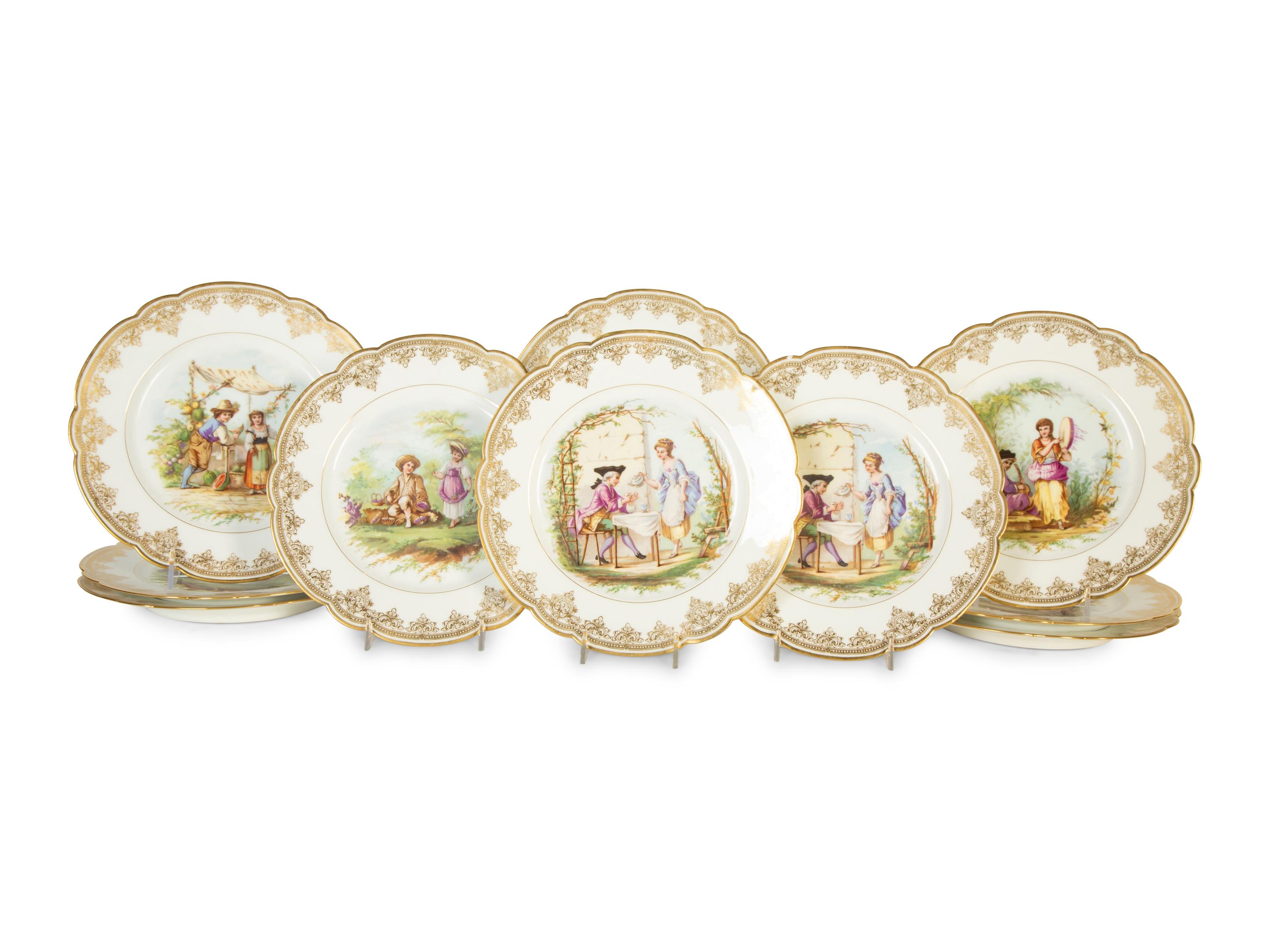 Twelve Sèvres Gilt Decorated Porcelain Dinner Plates