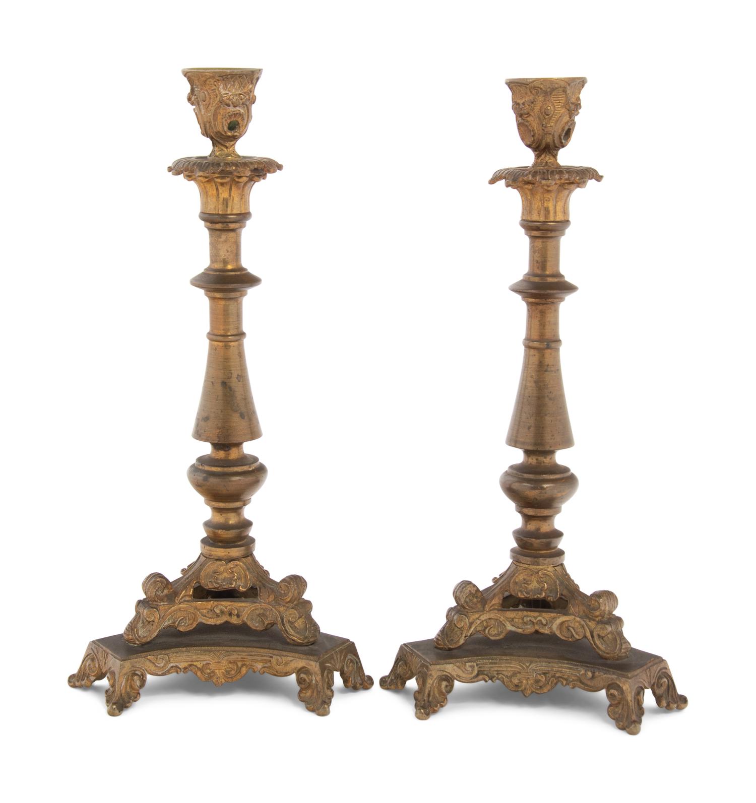 A Pair of Neoclassical Gilt Bronze and Brass Candlesticks