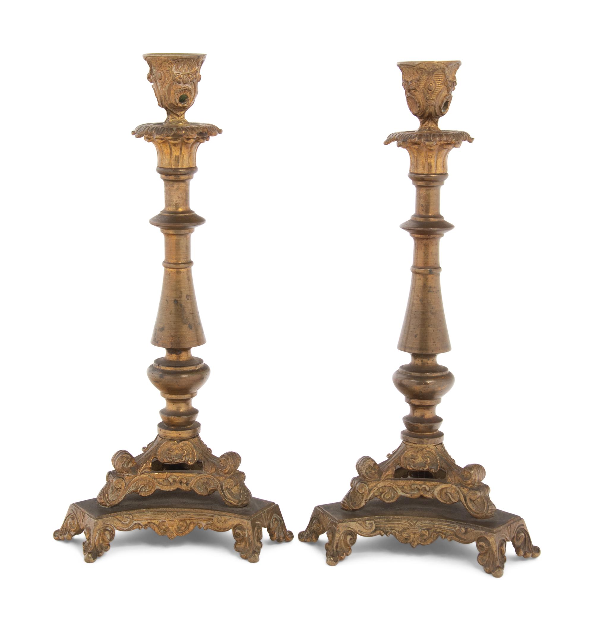 A Pair of Neoclassical Gilt Bronze and Brass Candlesticks