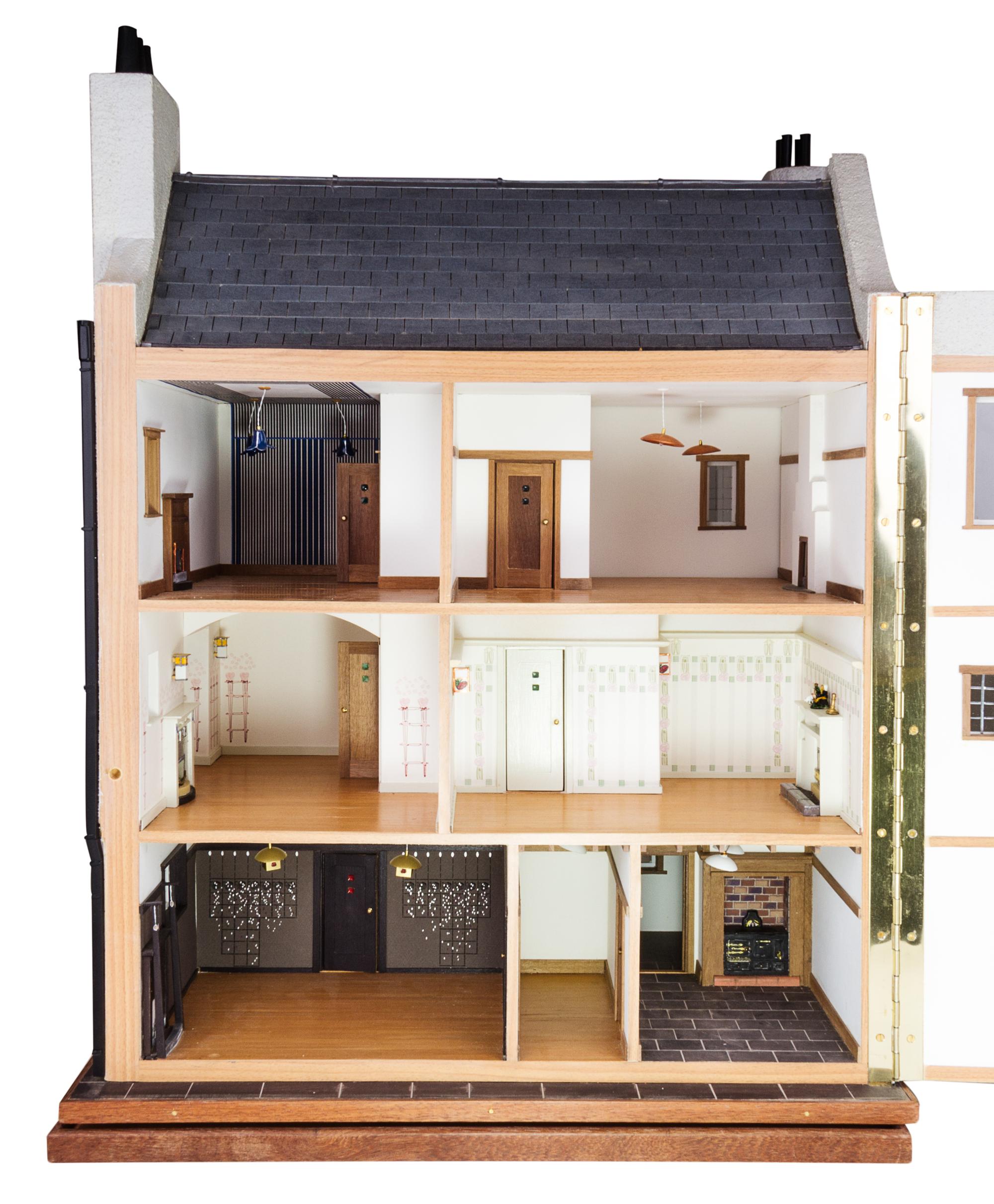 A Scottish Art Nouveau Style House Height 26 x width 12 1/4 x depth 19 inches.