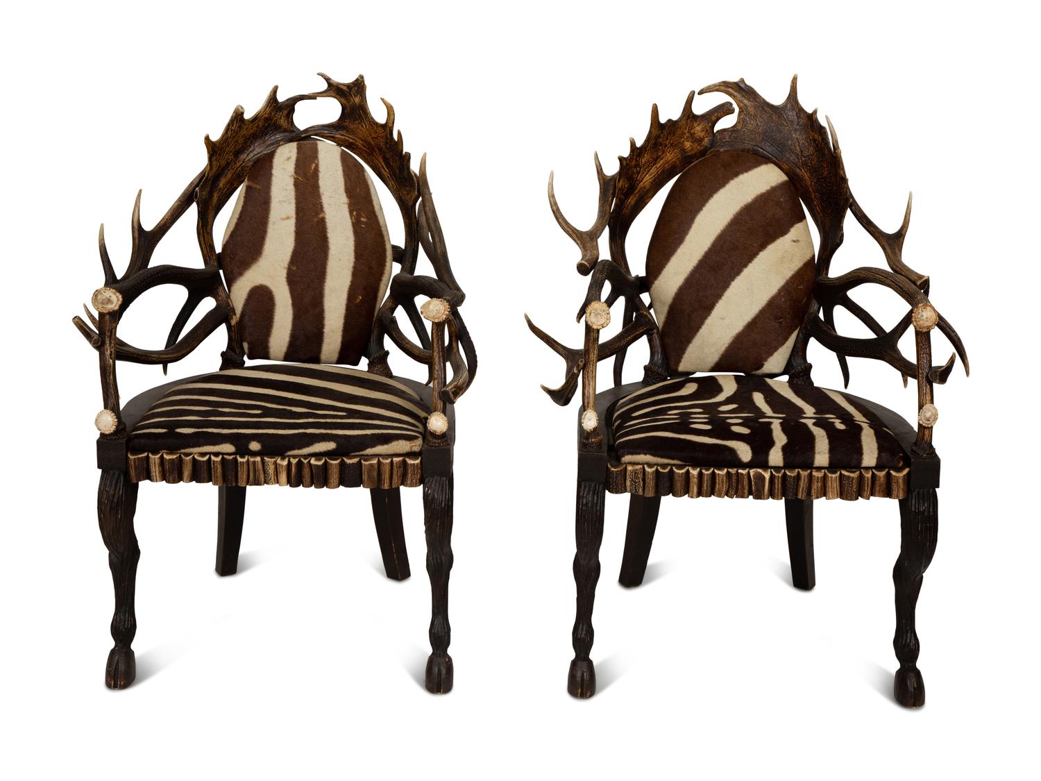 A Pair of Stag Antler Arm Chairs with Zebra Hide Upholstery Attributed to Anthony Redmile