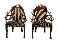 A Pair of Stag Antler Arm Chairs with Zebra Hide Upholstery Attributed to Anthony Redmile