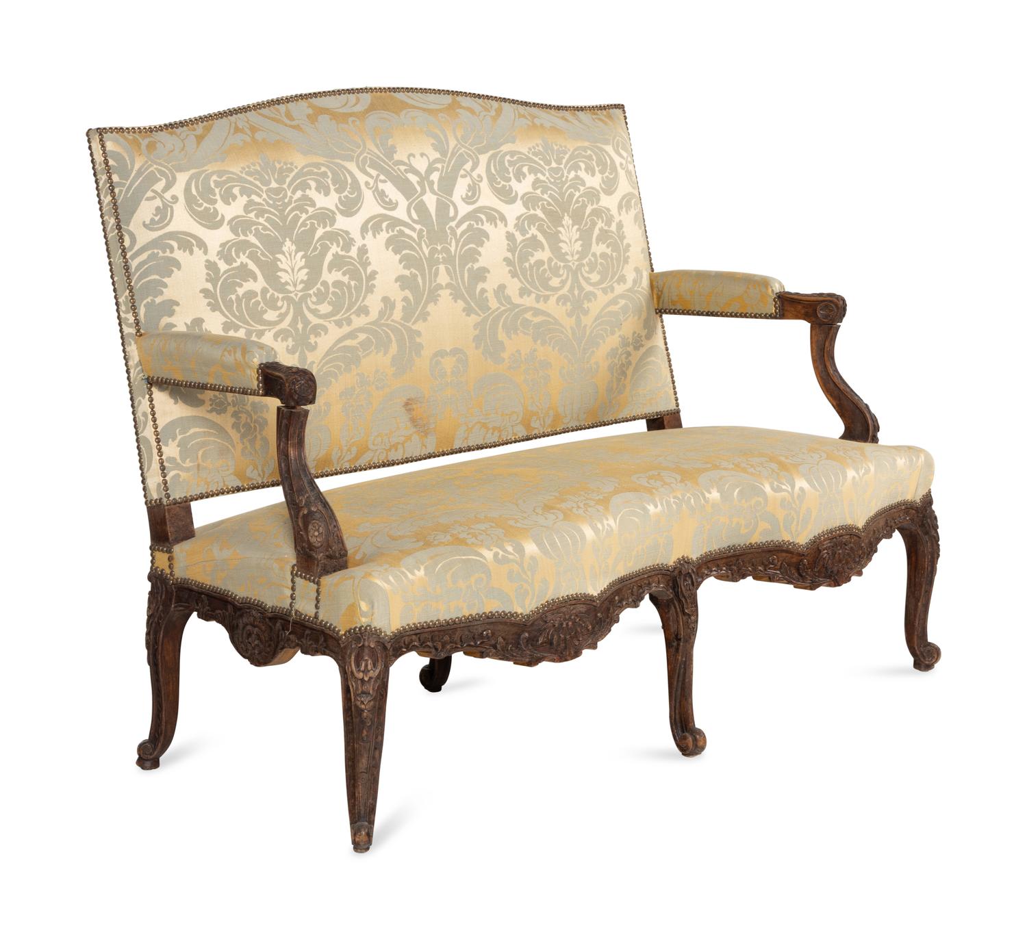 A Louis XV Style Carved Walnut and Silk Damask Upholstered Settee