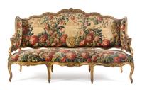 A Louis XV Giltwood Canape a Oreilles Height 45 1/8 x width 76 x depth 25 1/2 inches. — LATE 18TH/EARLY 19TH CENTURY