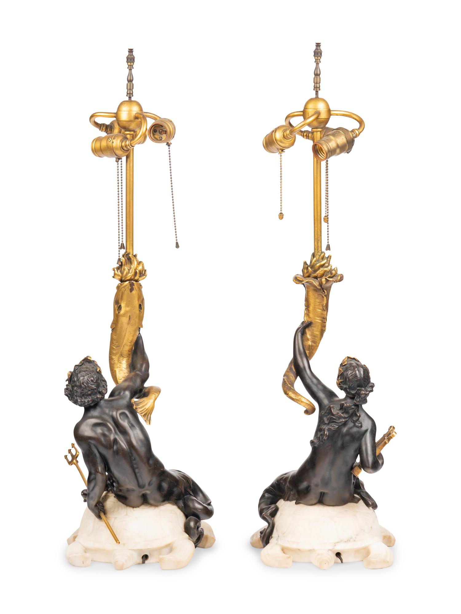 A Pair of American Gilt and Patinated Bronze and Carved Marble Figural Table Lamps