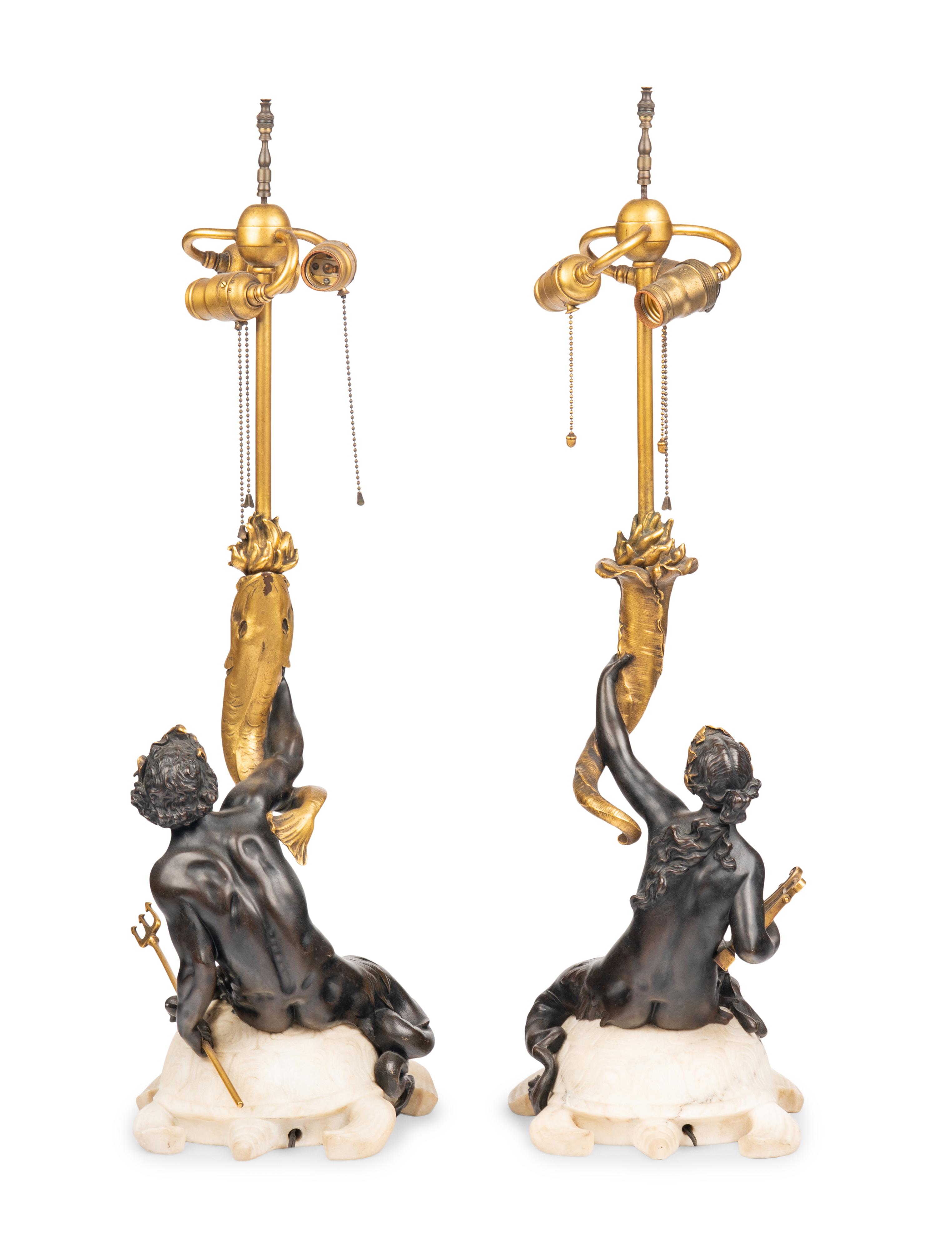 A Pair of American Gilt and Patinated Bronze and Carved Marble Figural Table Lamps