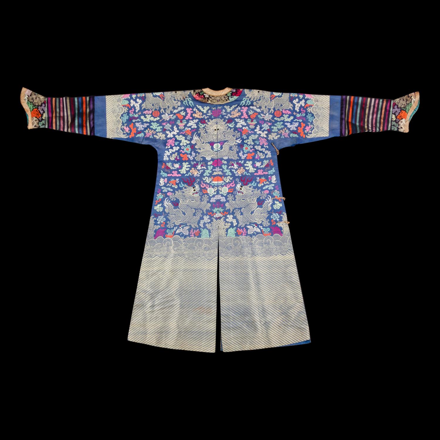 A Chinese Blue Ground Brocade 'Dragon' Robe, Jifu, Late Qing Dynasty 清晚期 藍地織錦云龍紋吉服