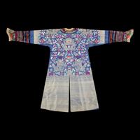 A Chinese Blue Ground Brocade 'Dragon' Robe, Jifu, Late Qing Dynasty 清晚期 藍地織錦云龍紋吉服