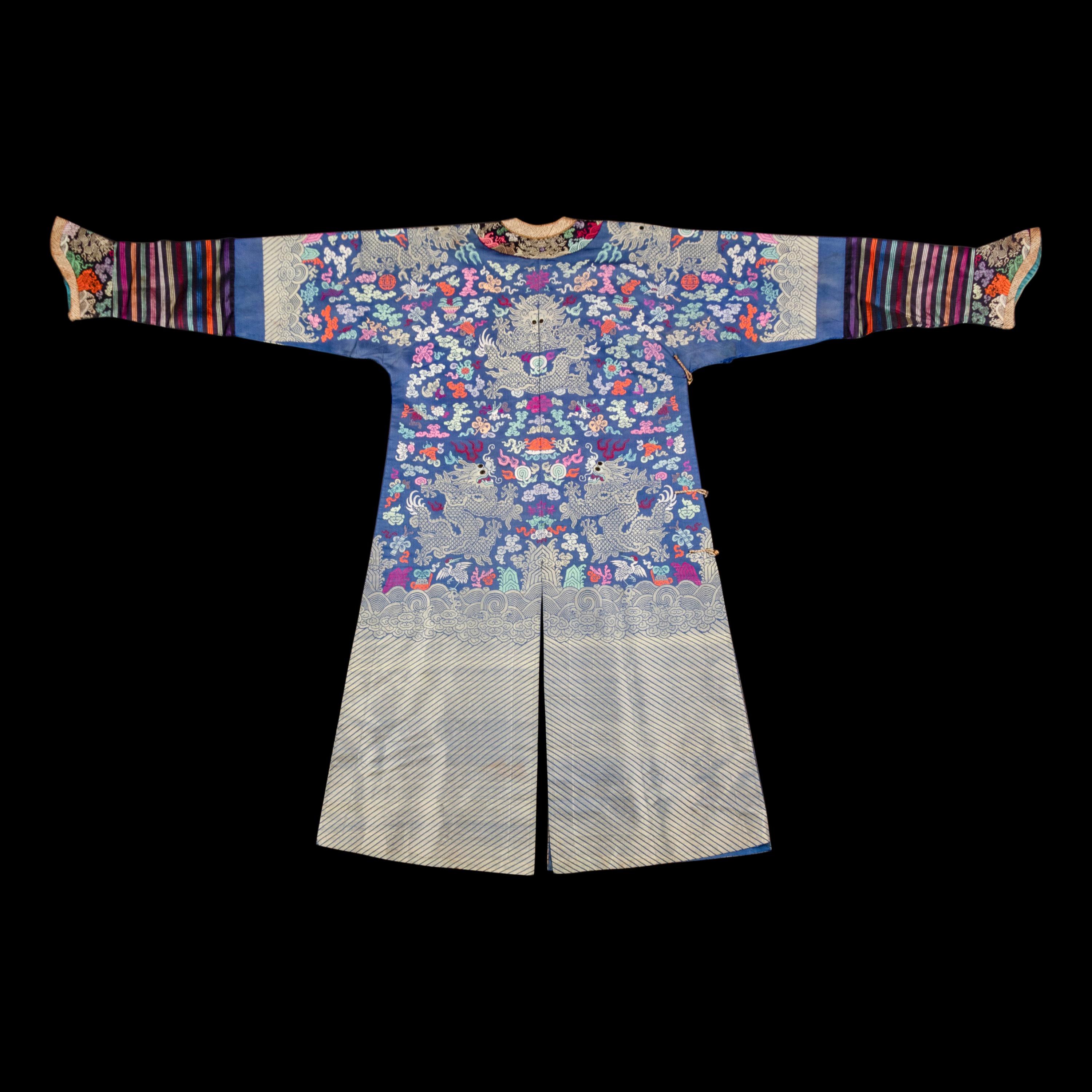 A Chinese Blue Ground Brocade 'Dragon' Robe, Jifu, Late Qing Dynasty 清晚期 藍地織錦云龍紋吉服