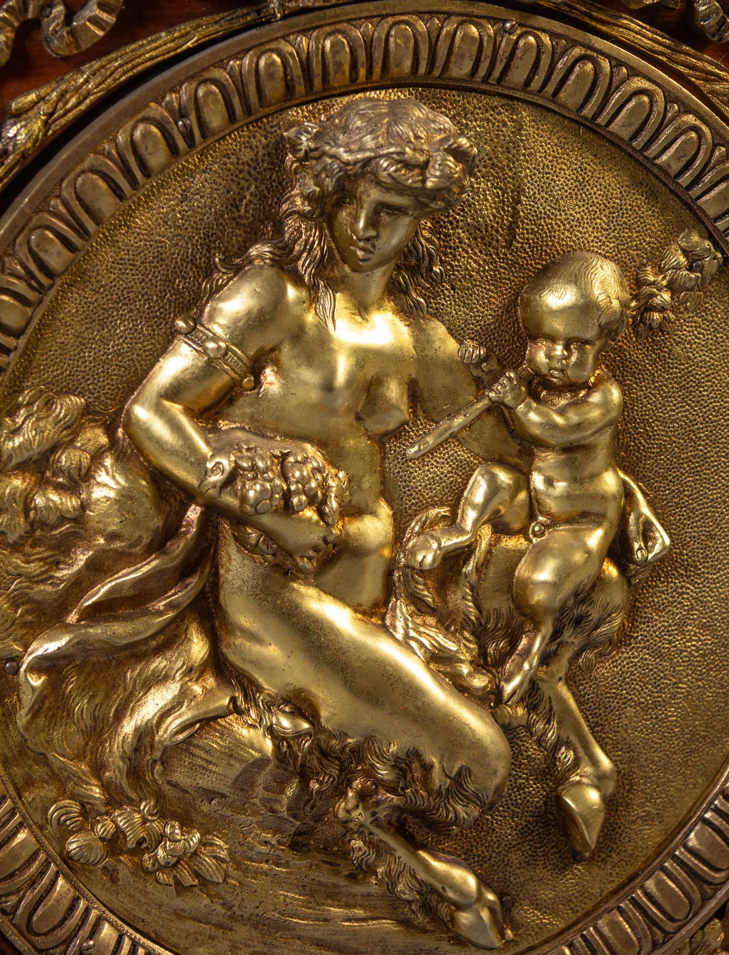 A Louis XVI Style Gilt Bronze Mounted Mahogany Marble-Top Commode à Vantaux, after the Model by Guillaume Benneman