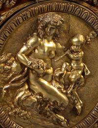 A Louis XVI Style Gilt Bronze Mounted Mahogany Marble-Top Commode à Vantaux, after the Model by Guillaume Benneman