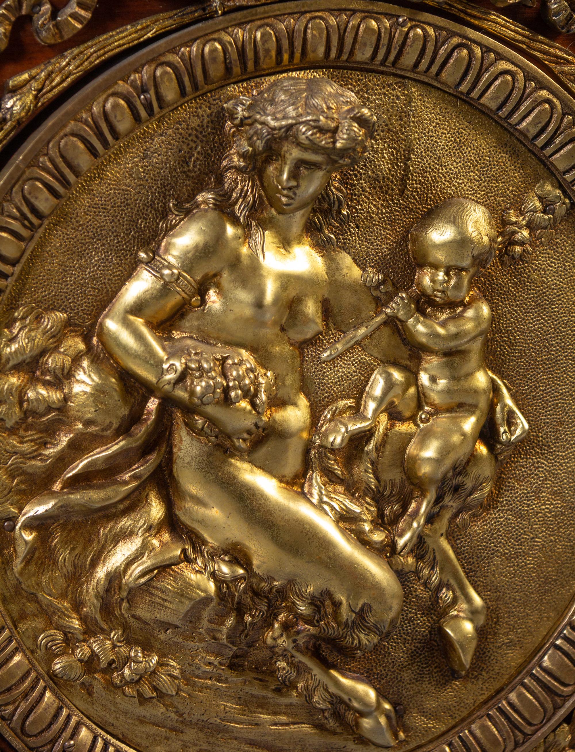 A Louis XVI Style Gilt Bronze Mounted Mahogany Marble-Top Commode à Vantaux, after the Model by Guillaume Benneman