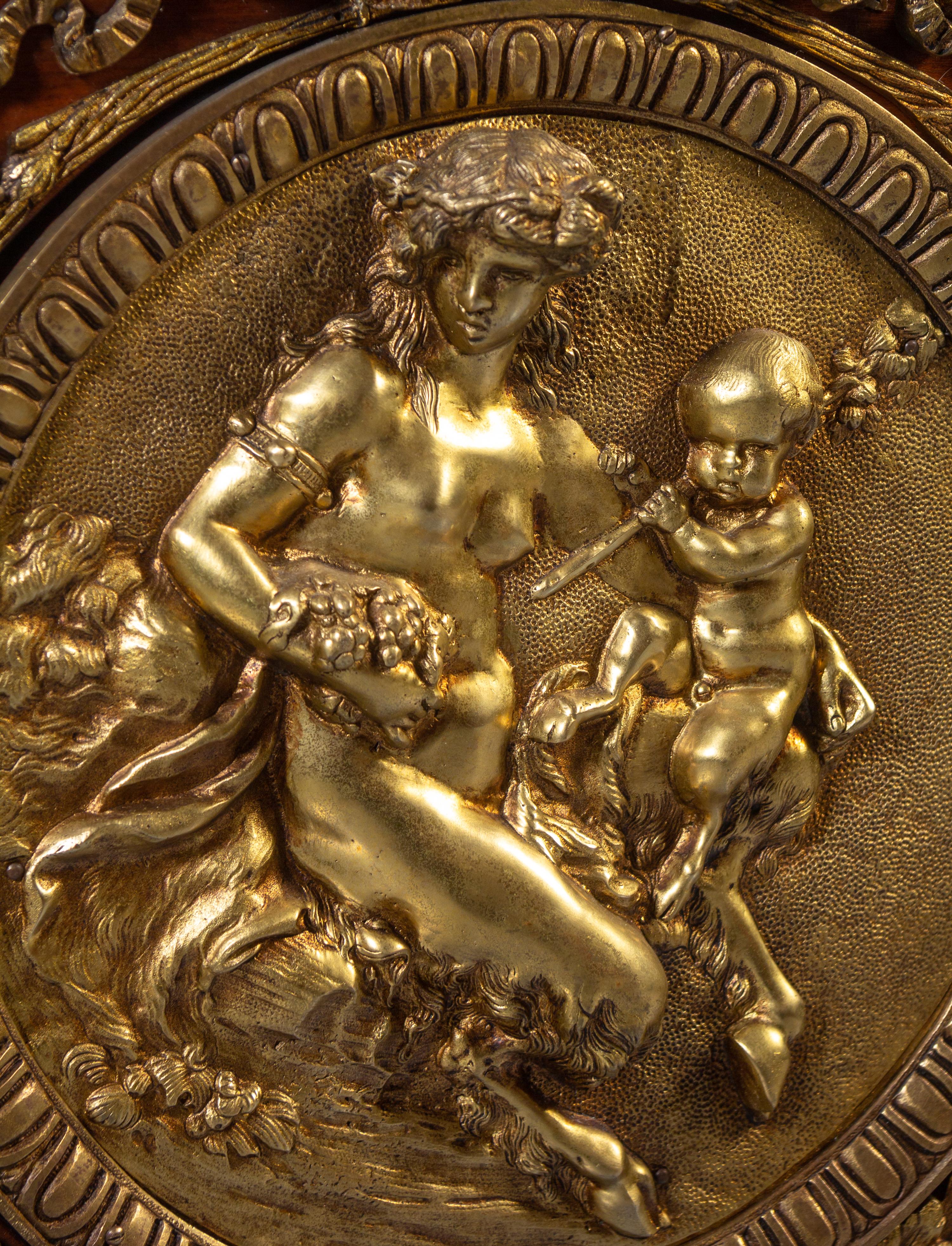 A Louis XVI Style Gilt Bronze Mounted Mahogany Marble-Top Commode à Vantaux, after the Model by Guillaume Benneman