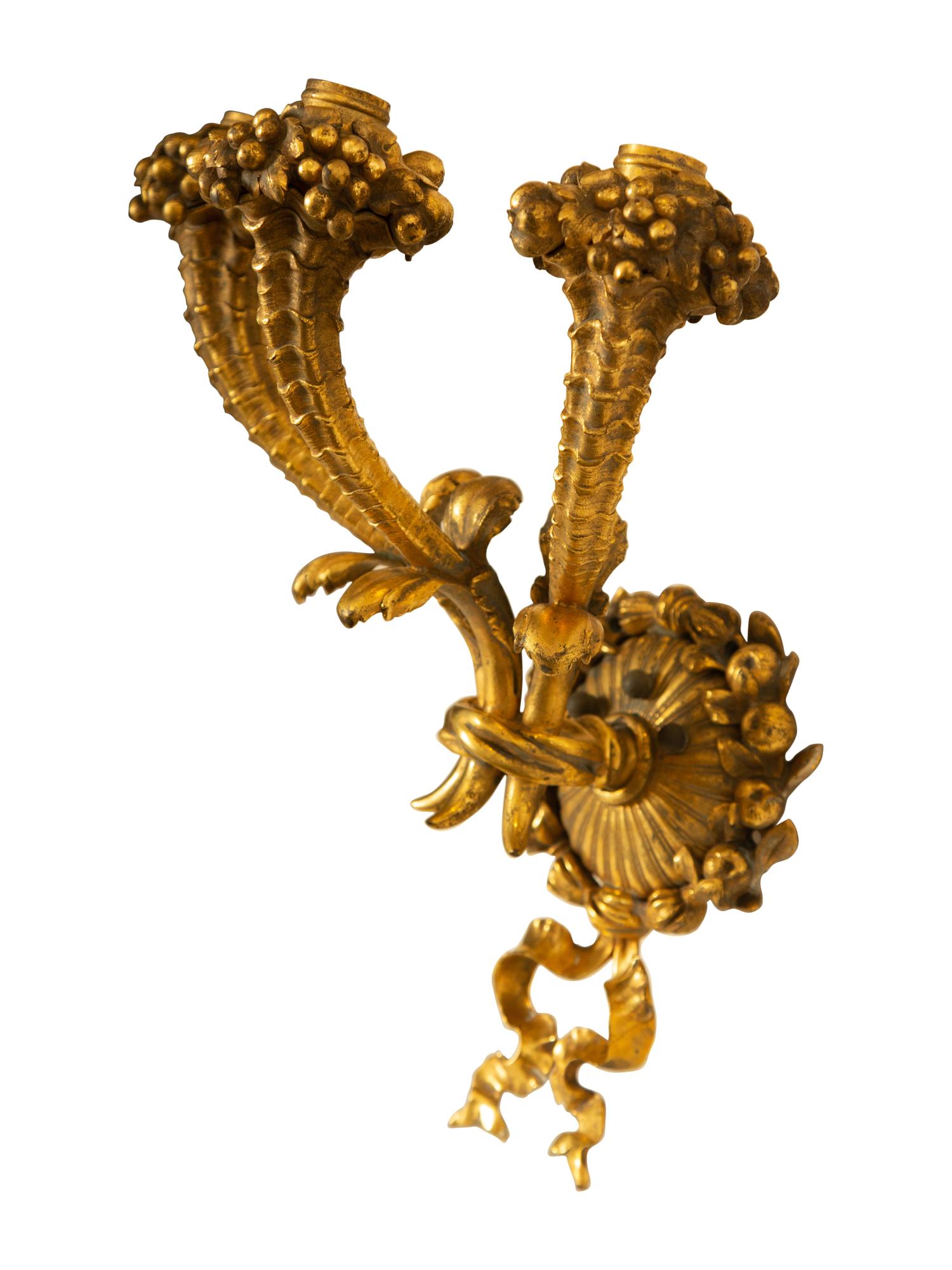 A Pair of French Gilt Bronze Three-Light Sconces