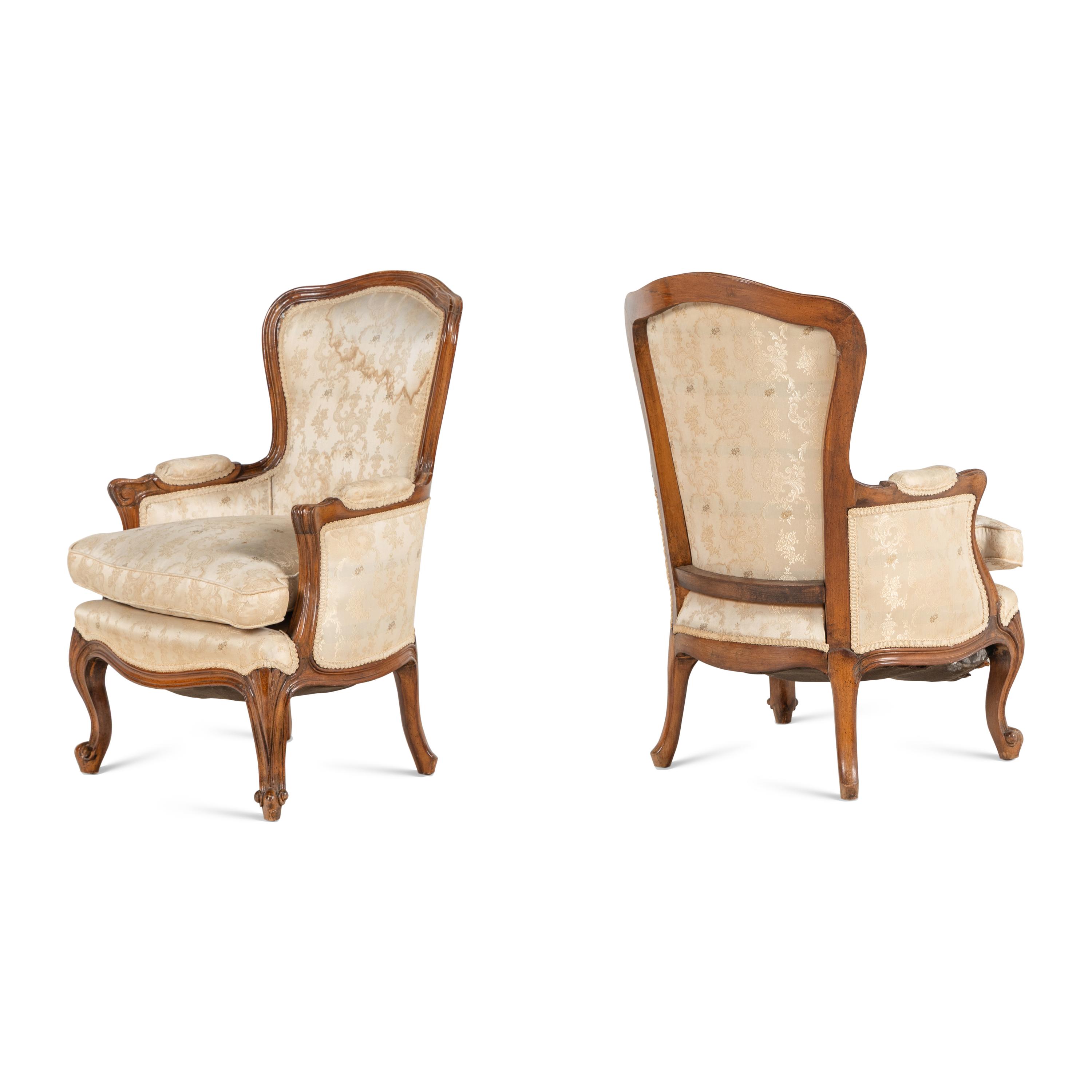 A Pair of Louis XV Style Carved Fruitwood Diminutive Bergerès