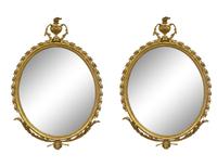 A Pair of George II Style Oval Giltwood Mirrors