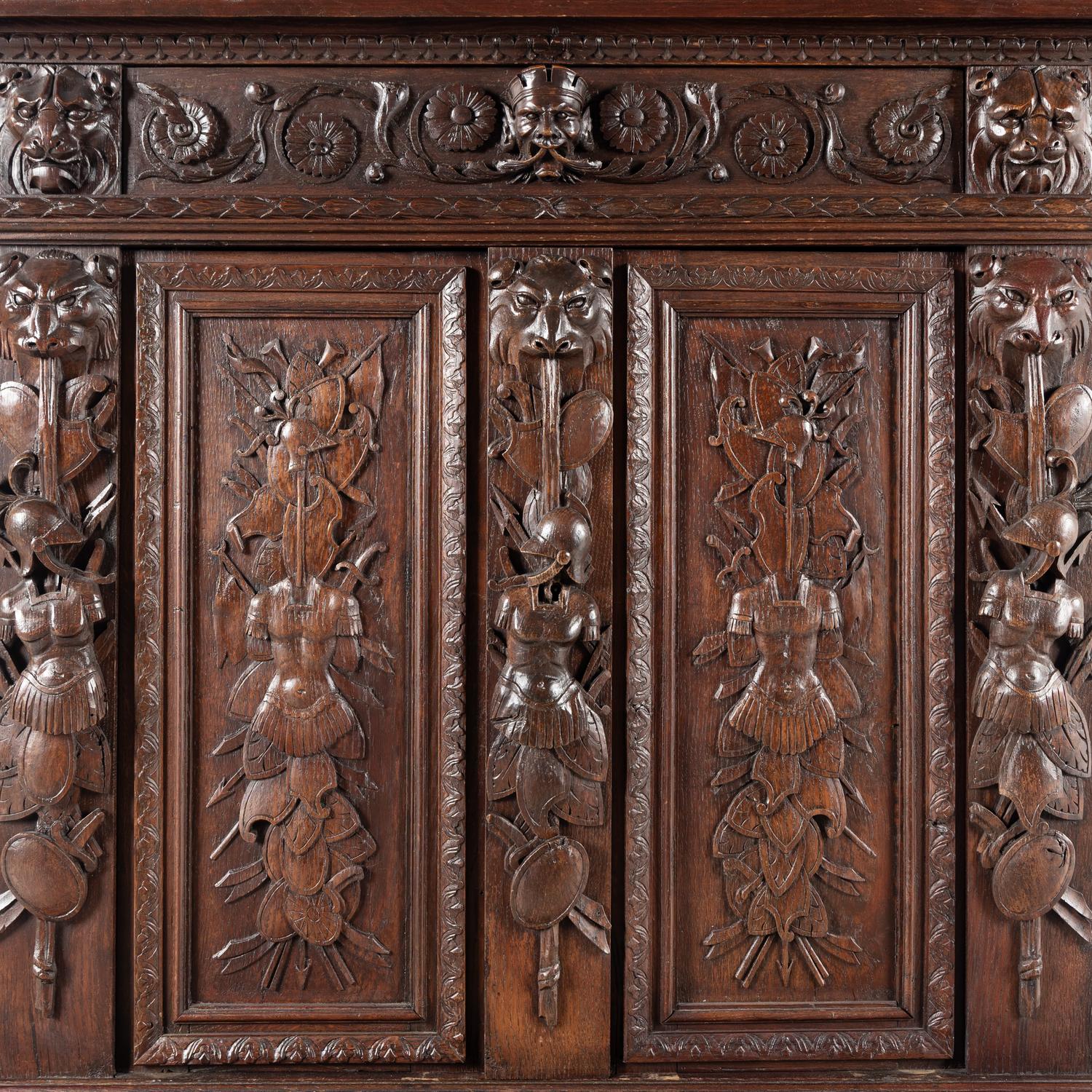 An Italian Renaissance Revival Carved Oak Cabinet