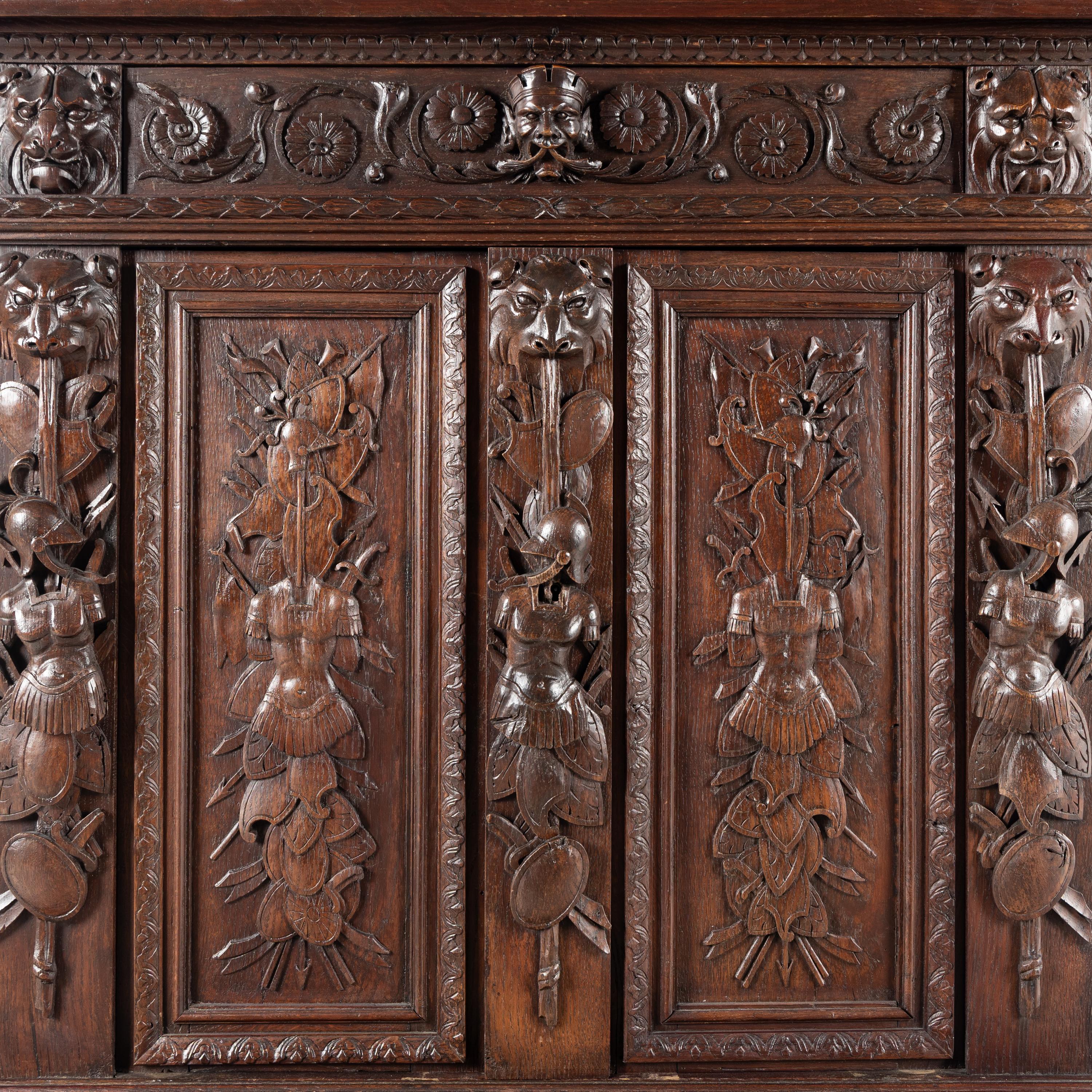 An Italian Renaissance Revival Carved Oak Cabinet