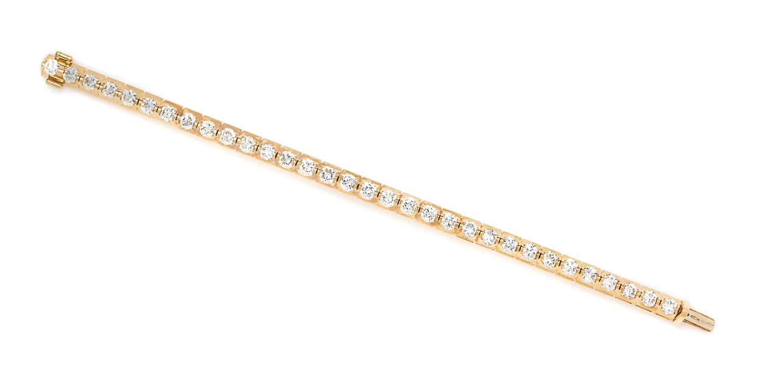 A Yellow Gold and Diamond Line Bracelet, 21.80 dwts.