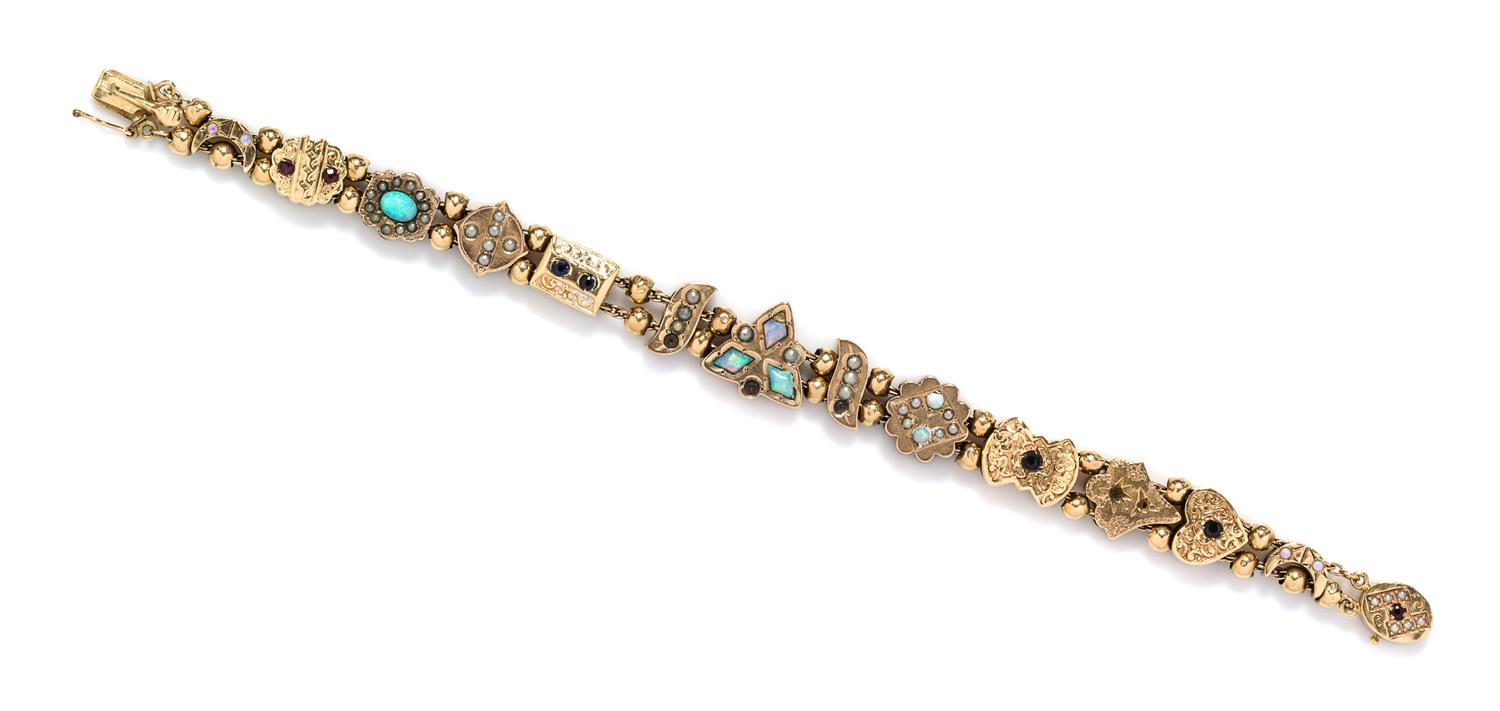 A 14 Karat Yellow Gold and Multi Gem Slide Bracelet, 13.10 dwts.