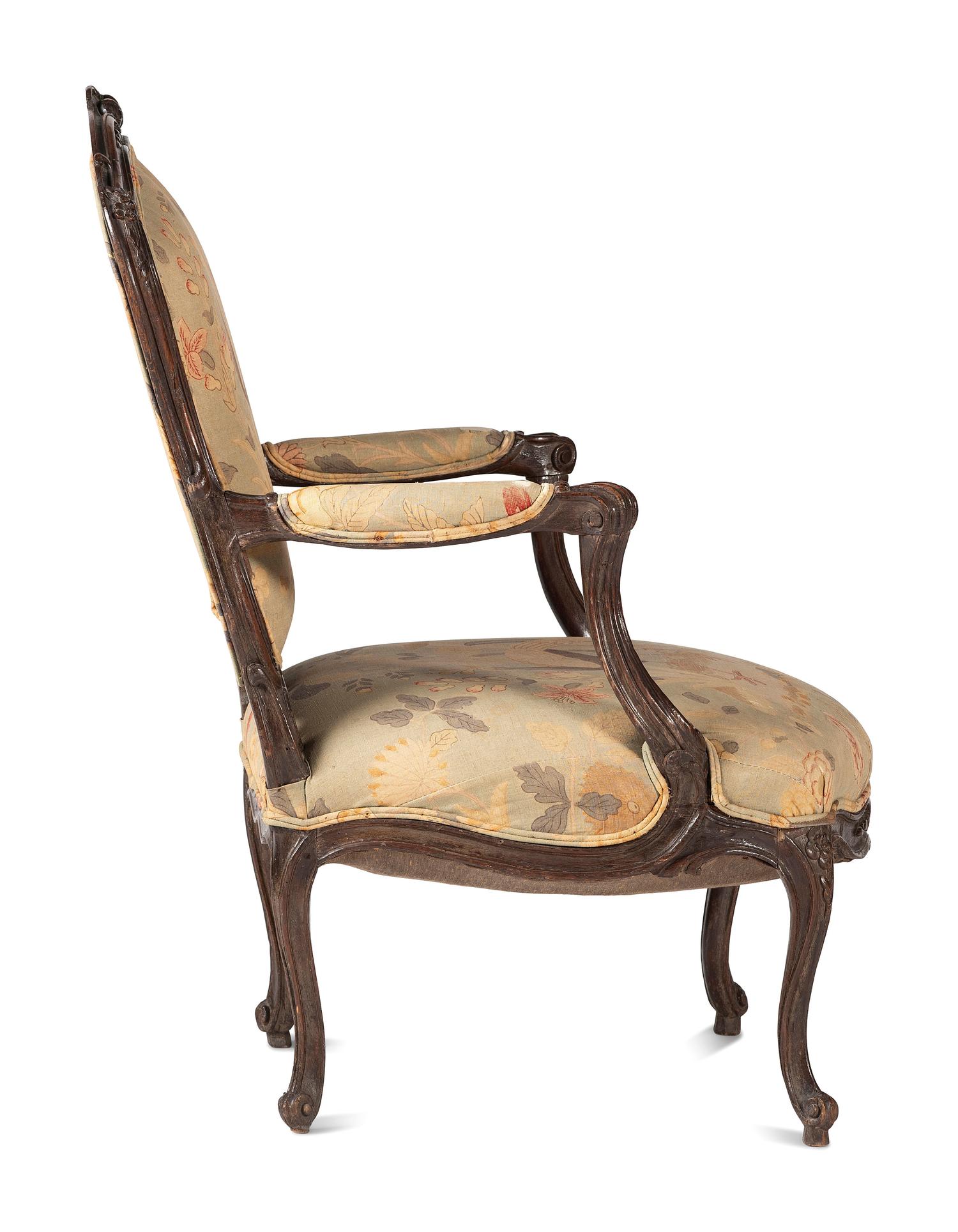 A Louis XV Carved Walnut Upholstered Fauteuil