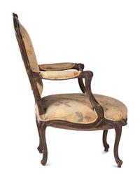 A Louis XV Carved Walnut Upholstered Fauteuil