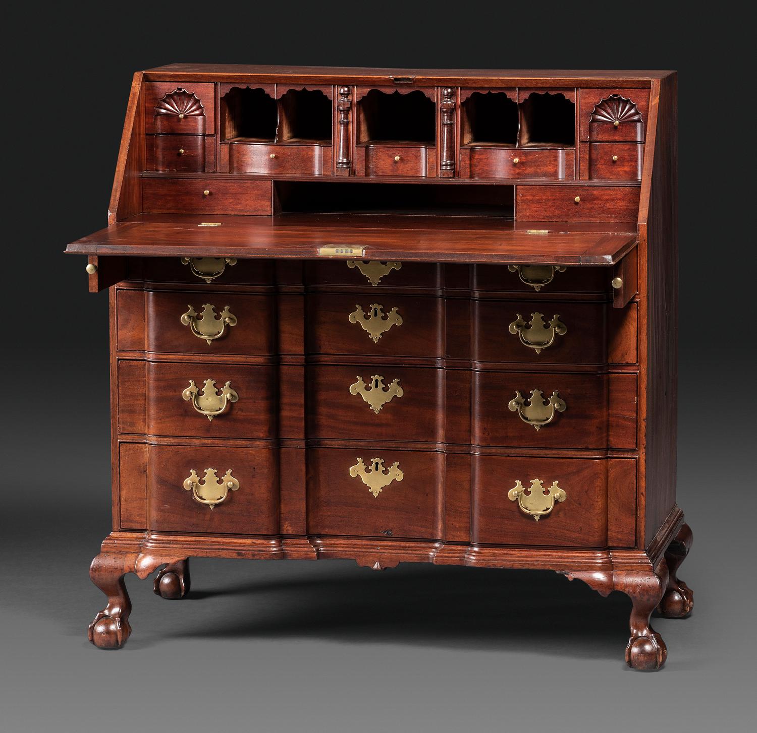 A Chippendale Figured Mahogany Block-Front Claw-and-Ball Foot Slant-Front Desk