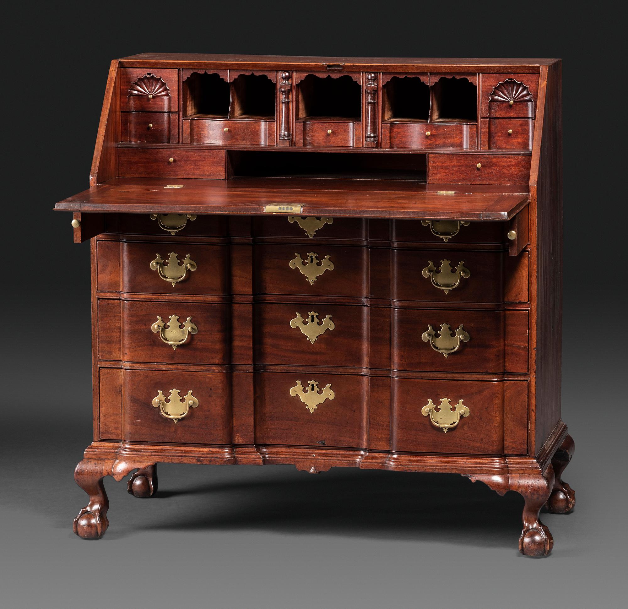 A Chippendale Figured Mahogany Block-Front Claw-and-Ball Foot Slant-Front Desk