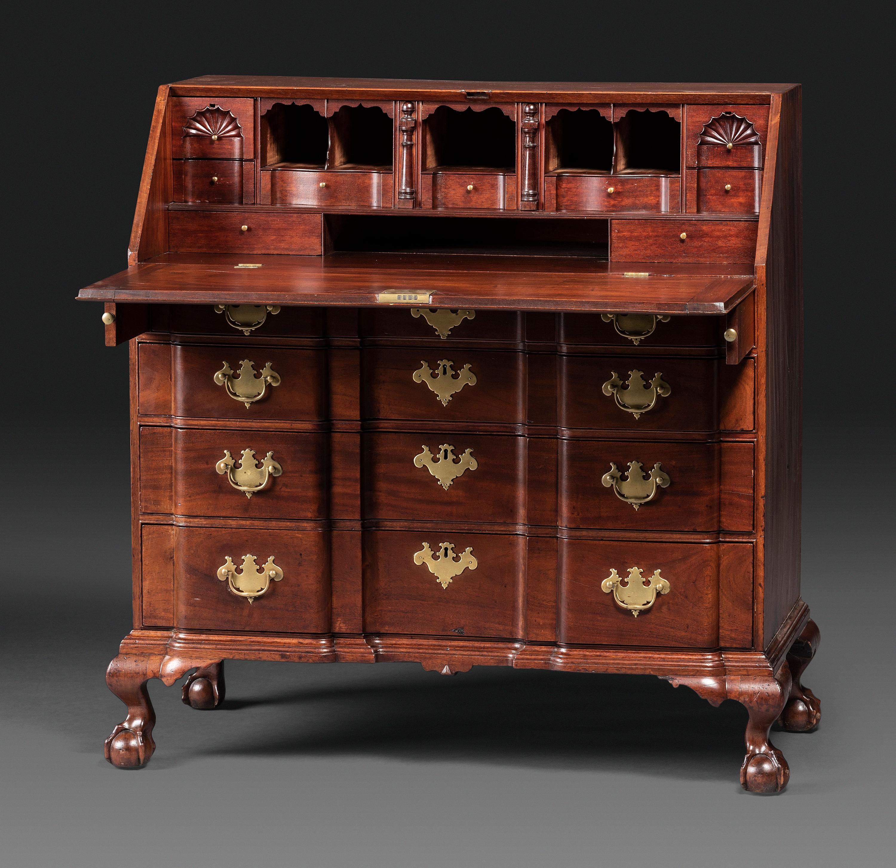 A Chippendale Figured Mahogany Block-Front Claw-and-Ball Foot Slant-Front Desk