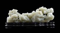 A Chinese Pale Celadon Jade ‘Lingzhi and Rockwork’ Brush Rest, 20th Century — 近代 青白玉靈芝筆架