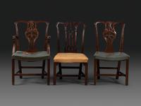 A Set of Six Chippendale Style Carved Mahogany Dining Chairs