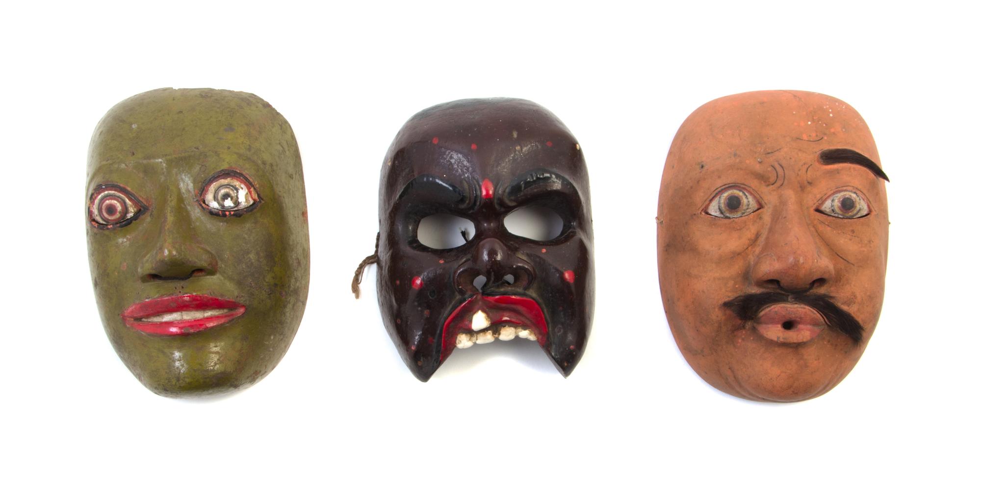 Three Painted Wood Masks Height of largest 7 3/4 inches.